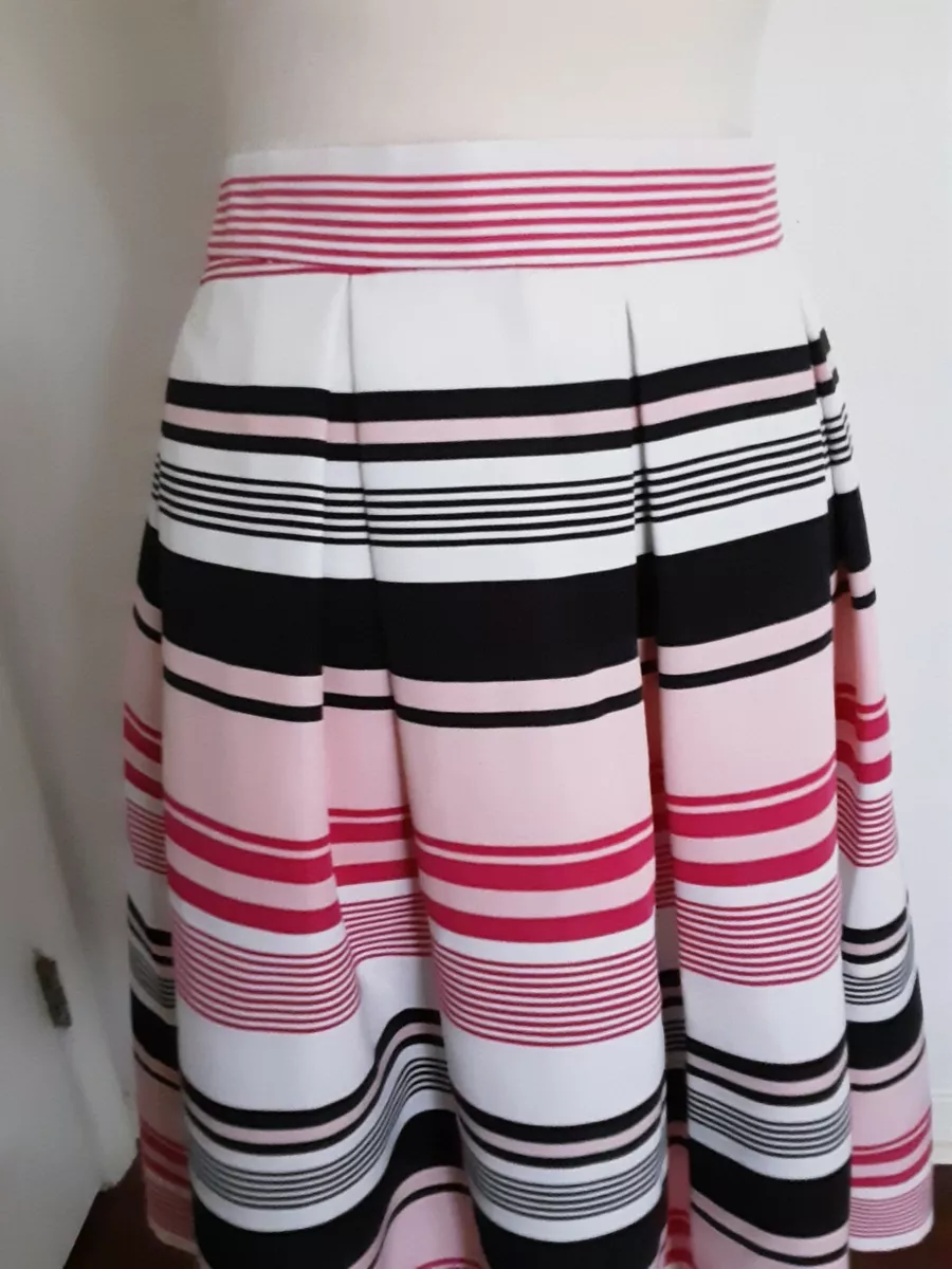 White company top pink pleated skirt