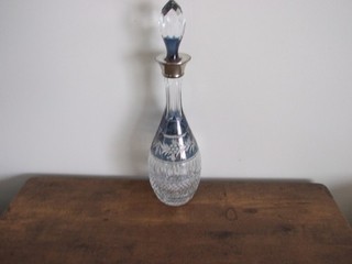 a.vintage cut glass decanter with silver collar