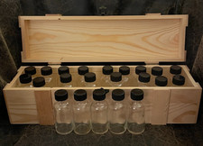 NEW-22 GLASS BOTTLES IN HEAVY WOODEN BOX- 18" X 4" X 4"- BOTTLES ARE 3.25" TALL