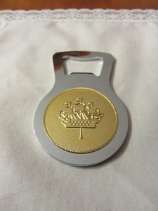 Bottle Opener with Foreign Coin Center