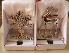Christmas Stocking Hangers 1 Set Of A Snowflake And Reindeer Metal Hangers