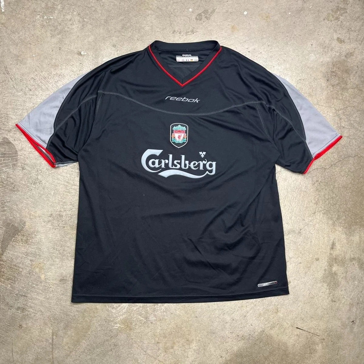 Preços baixos em Reebok Liverpool Preto Clube Internacional de