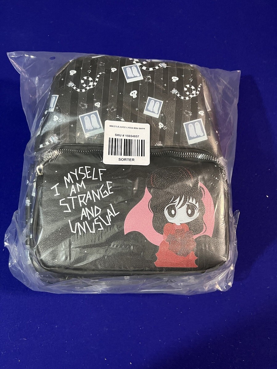 beetlejuice strange and unusual mini backpack EXCLUSIVE DROP: Loungefly Tombstone Glow This new Beetlejuice backpack is THE accessory to carry throughout spooky season Beetlejuice Icons Mini Backpack