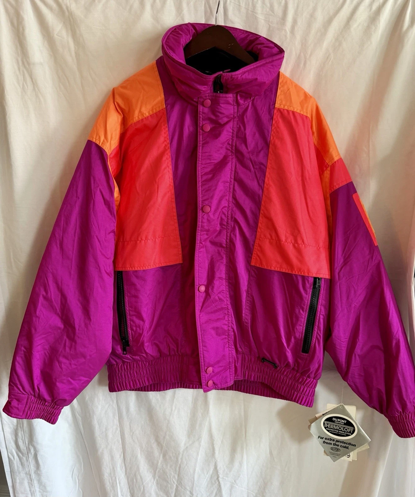 Vintage Solus ski jacket, 80s and 90s style, neon orange and purple. Size L.
