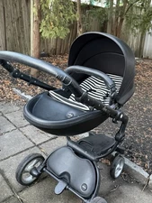 Mima Xari signature stroller black and white seat kit basinet and seat raincoat