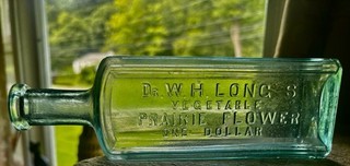 Excellent : "Dr. W.H. LONG'S VEGETABLE PRAIRIE FLOWER ONE DOLLAR" 9" X 2 3/4".