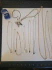 Lot of 12 Vintage s Avon jewelry pieces - necklaces, and sterling silver rings.