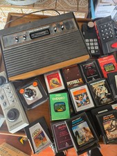 Console vintage Atari 2600 venatura del legno, giochi, joystick e pagaie