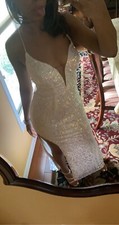 White sequins prom dress, from prom girl, long, size 6, has a tie back