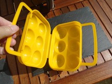 yellow plastic retro looking egg storage