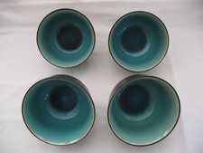 FOOTED ASIAN STYLE CERAMIC BOWLS LOT OF FOUR, LIKELY WITH CELADON GLAZE