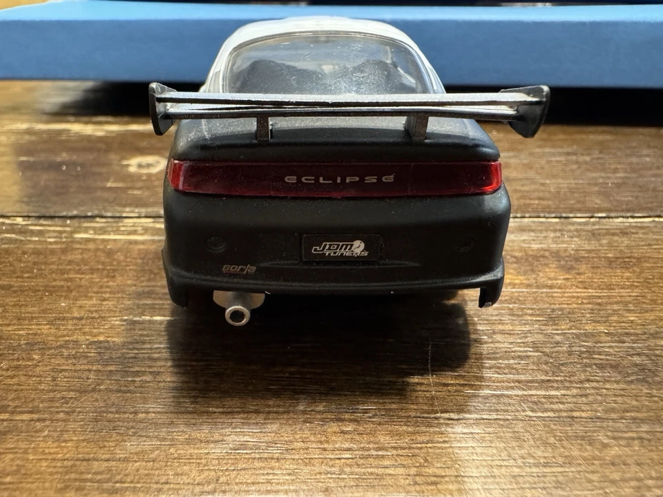 Coche diecast Jada Toys 1995 Mitsubishi Eclipse escala 1/32 blanco y negro Foto 4 de 4