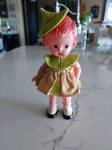VINTAGE BABY RATTLE: COLLECTIBLE KEWPIE-STYLE DIMESTORE MOLDED 6" PLASTIC DOLL