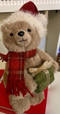 PLUSH BEAR WITH SANTA HAT PLAID SCARF HOLDING GIFT