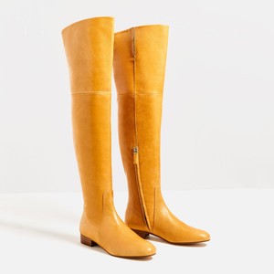 yellow flat boots