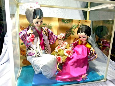 korean dolls in glass case