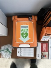 AED Defibrillator Wall Mounted Storage Cabinet And Defib With Brand New Battery