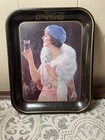 This is a vintage 1973 Coca-Cola flapper girl metal serving tray. Gently Used