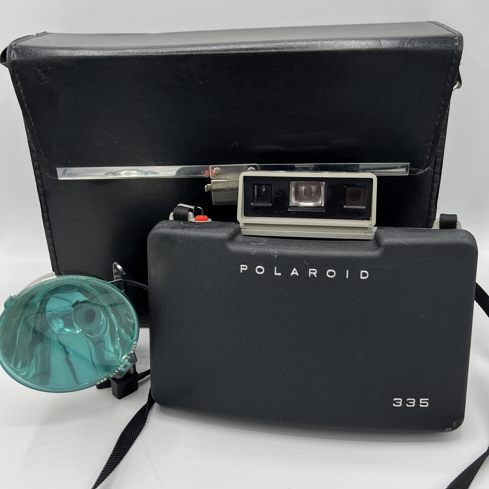 Brown leather-bodied Polaroid Automatic 335 Land Camera, folded, with its original case