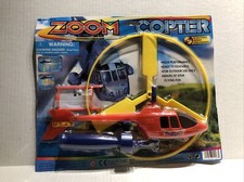 ZOOM COPTER - Flies Over 100 FT. No Batteries Needed  NIP