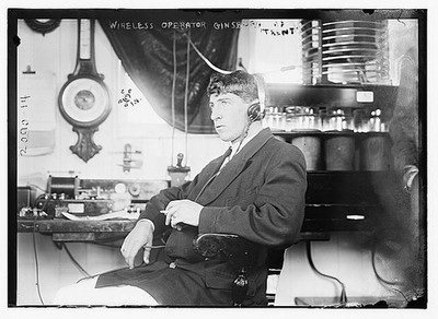 Wireless operator Ginsberg of Trent,smoking cigarette,male,headphones,Bain News