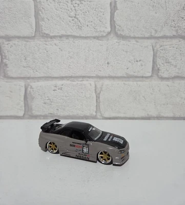 Jada Toys 2002 Nissan Skyline GT-R R34 Grey/Brown Nismo diecast premium rubber - Image 1 of 4