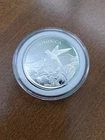 1 oz silver round Dominica in a plastic case