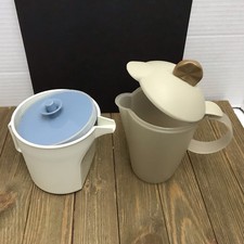 Two Tupperware Tiny Pitcher Style Creamers