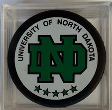 UNIVERSITY OF NORTH DAKOTA WCHA NCAA OFFICIAL GAME PUCK - INGLASCO CANADA