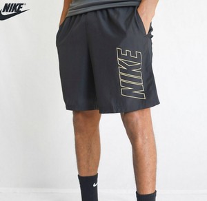 gold nike woven shorts