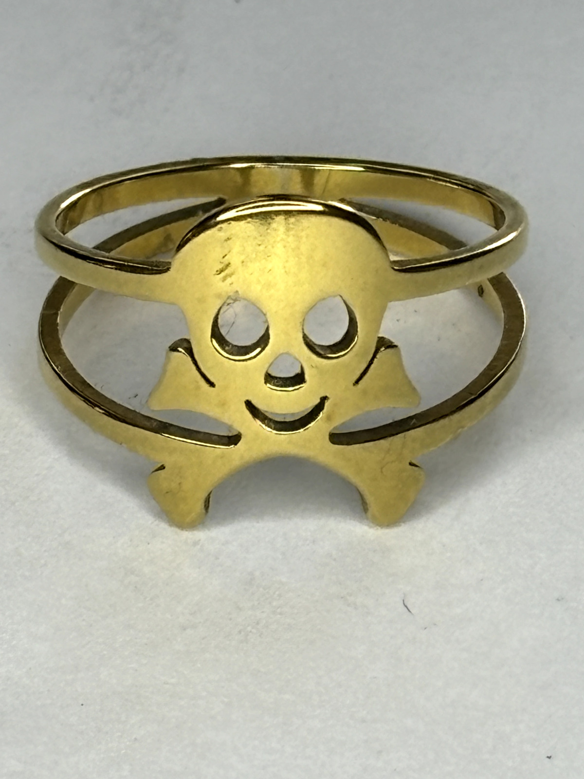 VINTAGE '60's GOLD TONE CUT OUT SMILING SKULL IMA… - image 1