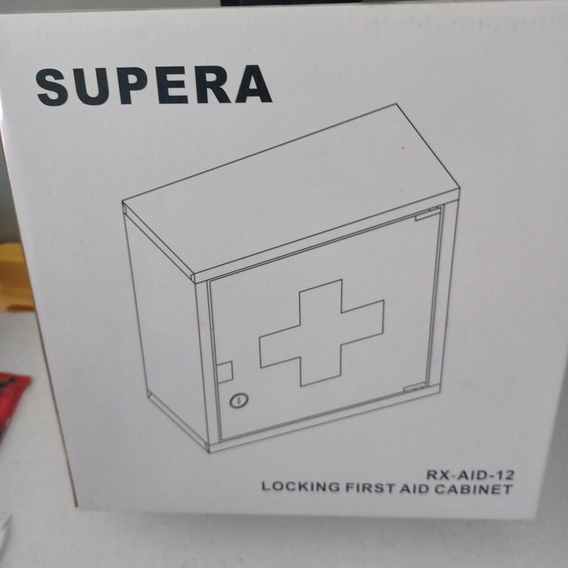 New In Box Locking First Aid Cabinet. Ready To Use With Key
