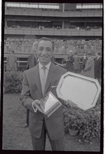 Eddie Arcaro holds trophies from Eddie Arcaro Day Aqueduct Race- 1962 Old Photo