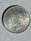 1922 Peace Dollar $1 in About Uncirculated Condition