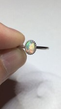  110B- .45ct Genuine Ethiopian Welo Opal set in a Size 7 Sterling Silver Ring