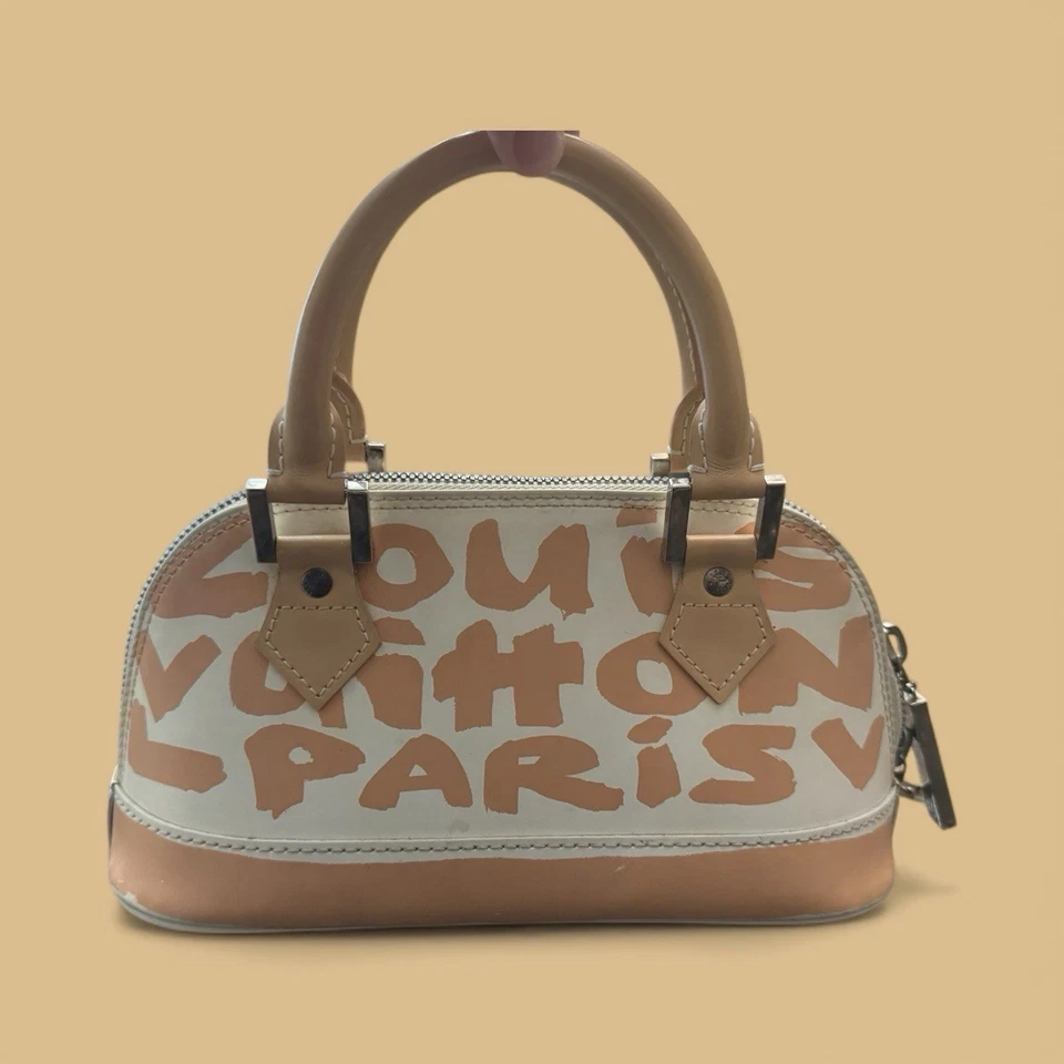 Bolso Louis Vuitton Alma con asa superior PM beige cuero blanco Foto 2 de 4