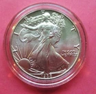1988 AMERICAN SILVER EAGLE, UNCIRCULATED. NO BOX OR COA. IN CAPSULE.