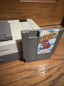 Nintendo NES Console W/games. No Controller/Power Cord
