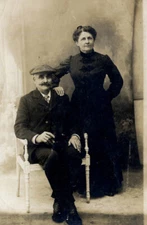 #31769 France 1900s.  Man with cigar & woman. Photo PC size RPPC.