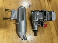 O.S. 46 LA Engine with Muffler - Silver. New in Box