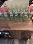VTG LOT OF 13 GREEN 10 oz COCA COLA BOTTLES-FROM LA-NC-LA-AL-MD-GA-OH-AZ-IN-OK