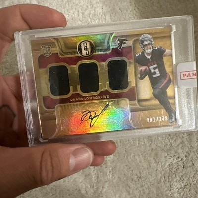 2022 Panini Gold Standard- Triple jersey Drake London #282 001/149 (AU, MEM, RC)