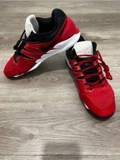 Nike Air Zoom Vapor X HC tennis shoes in University Red and black.