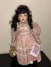 Heritage Mint Porcelain Doll in Pink Dress with Basket