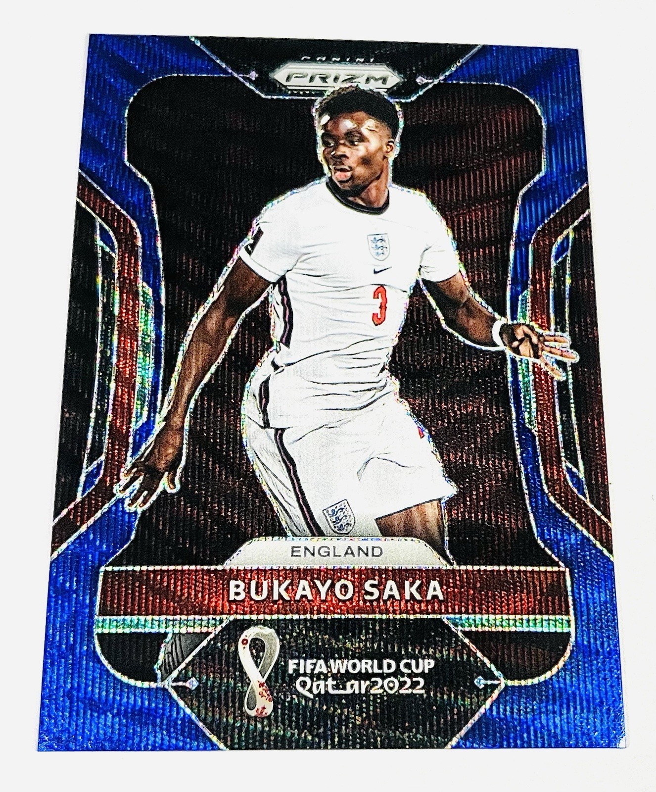 Bukayo Saka 2022 Panini Prizm FIFA World Cup #84 Blue Wave Prizm 062/199 England