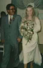 Bride and Groom Walking Hand in Hand Wedding Day Joy Floral Decorations