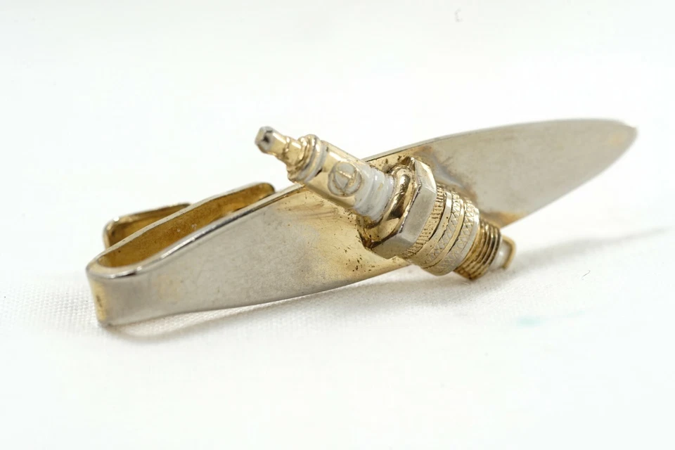 Bujías Speidel Autolite años 50 mediados de siglo esmaltadas tono dorado cierre de corbata Foto 2 de 4