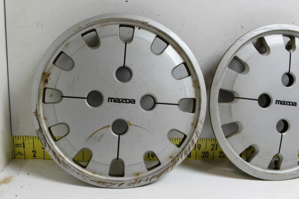 Juego de 4 tapacubos usados OEM G12037170 1986-1987 Mazda 626 363 (3345) Foto 2 de 4