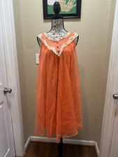 Vintage 1960s Lisette babydoll nightgown in orange chiffon with cream lace trim.