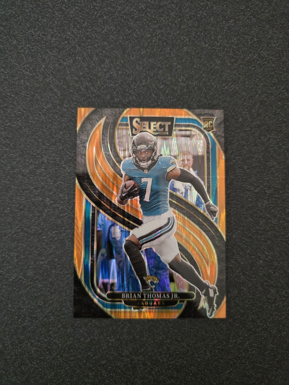 Brian Thomas Jr. 2024 Panini Select Black & Orange Prizm Shock RC 143 7/399